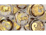 Astral influences, special series for Corisia, 1966 and following by Piero Fornasetti, Series of twelve dishes in silk and golden porcelain porcelain, offered Apr 2025