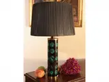 Metal table light by Piero Fornasetti, of cylindrical shape, offered Apr 2025