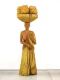 Josef Felix Müller, Tragerin (geel), 1998, Willow wood and varnish sculpture