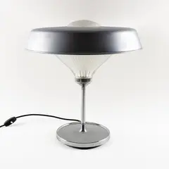 Prod. Artemide by Bbpr Studio, 1963, Ro mod. table lamp in chromed metal and pressed glass with slight wears Literature: G. Gramigna, offered Jun 2026
