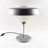 Bbpr Studio, Prod. Artemide, 1963, Ro mod. table lamp in chromed metal and pressed glass with slight wears Literature: G. Gramigna