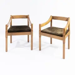 Prod. Cassina by Vico Magistretti, pair of Carimate mod. armchairs in wood and padded fabric, offered Jun 2026