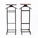 Prod. Fratelli Reguitti by Ico Parisi, Pair of wooden and brass valet stands, offered Feb 2026