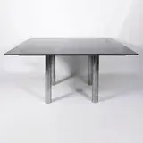Prod. Gavina by Afra & Tobia Scarpa, Andrè mod. table in chromed metal and fume glass, offered Dec 2025