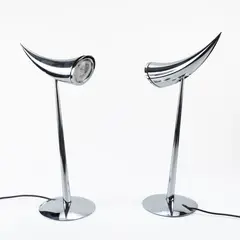 Prod. Flos by Philippe Starck, 1988, pair of Ara mod. table lamps in chromed steel, offered Dec 2025
