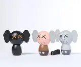 Kaws, Holiday. Japan, Tre sculture-profumatori in vinile verniciato