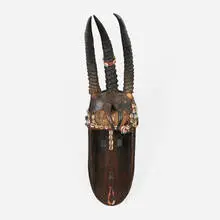 Bamana, Ntomo mask, c. 1950, carved wood, horn, shells, beads, glue, metal