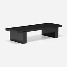 Coffee table by Jacques Adnet, c. 1940, lacquered wood, black glass, sold Mar 2023