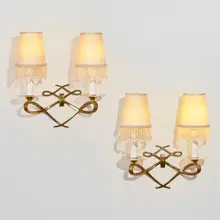 René Prou, Wall sconces, pair, c. 1940, brass, electroplated metal, frosted glass, linen, plastic beads
