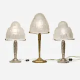 Schneider, Collection of three table lamps, c. 1925, frosted glass, nickel-plated brass, patinated bronze