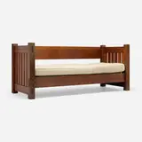 Knock-down settle, model 210 by Gustav Stickley, c. 1912, oak, canvas upholstery, sold Mar 2024