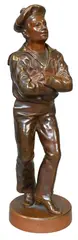 Jean Garnier, La Gigue, Bronze on wood base, depicting a young boy in sailor uniform