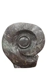 Dual Sided Form by C. Mushinga, Carved stone dual sided sculpture of an eye to one side and a human figure to other, offered May 2026