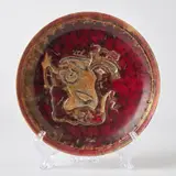 Pietro Melandri, Piatto con decoro a rilievo raffigurante volto