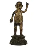 A Tibetan Gilt, Untitled, bronze figure of buddha