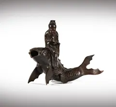 A Japanese, Untitled, bronze figure of a scholar on koi fish