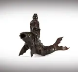 A Japanese, Untitled, bronze figure of a scholar on koi fish