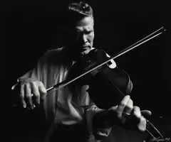 Jim McGuire, Framed, gelatin silver print on paper, Vassar Clements playing the fiddle, pen