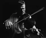 Jim McGuire, Framed, gelatin silver print on paper, Vassar Clements playing the fiddle, pen