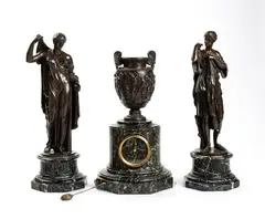 French triptych with bronze mantel clock by Ferdinand Barbedienne, Consisting of two patinated bronze statues depicting female figures, offered Jun 2024