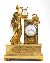 Pierre-François Feuchère, French Empire bronze mantel clock, Mercury-gilded bronze case resting on four leafed feet