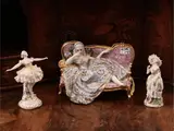 Luigi Fabris, Three porcelain groups, one depicting a lady in eighteenth-century clothes lying on a sofa