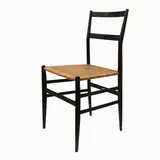 Gio Ponti, Series of four 699 Superleggera chairs, produced Figli di Amedeo Cassina 1957, made of black lacquered ash with rattan seat