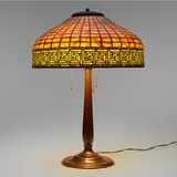 Greek Key table lamp by Tiffany Studios, c. 1910, leaded glass, patinated bronze, sold Dec 2023