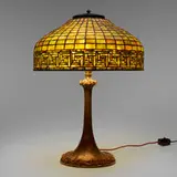 Greek Key table lamp by Tiffany Studios, c. 1910, leaded glass, patinated bronze, sold Dec 2023