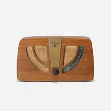radio, model 6D030W by Charles and Ray Eames, 1946, walnut plywood, upholstery, brass, Bakelite, sold Feb 2017