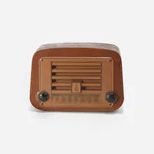 radio, model 587A by Charles and Ray Eames, 1946, walnut plywood, plastic, Bakelite, sold Feb 2017