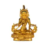 A Tibetan Gilt, Untitled, bronze figure of a seated buddha