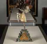Demetre Chiparus, : Nubian Dancersilver and gilt, bronze on a marble base, with metal relief of an Egyptian motif applied to front of base