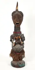 Democratic Republic of the Congo by Songye peoples Nkisi power figure, Carved wood figure with tacks covering face/head, copper attachments, snail shel, offered Apr 2026