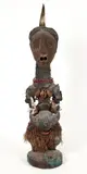 Democratic Republic of the Congo by Songye peoples Nkisi power figure, Carved wood figure with tacks covering face/head, copper attachments, snail shel, offered Apr 2026