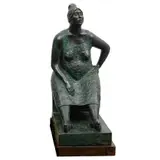 MUJER SENTADA by Carlos Aguirre, Bronce, patinado en color verde; con base de madera, offered Jun 2023