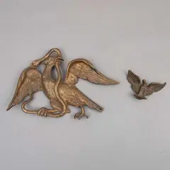 CA. by Figuras de Águilas, 1900, Bronce dorado, una de ellas representando el escudo nacional mexicano, la otra en reposo con las alas explayadas, offered Apr 2023