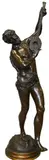 Victor Rousseau, Male Bacchant Musician Patinated, bronze on brass base depicting a figure in lion skin dancing and holding an instrument