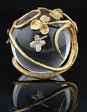 Claude Lalanne, "Trefle d'Or" Paperweight clear crystal "sulfur" sphere integrating a natural four-leaf clover overlaid in gold, supported by a gilt, bronze foliate cradle composed of winding stems and applied leaves