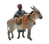 Franz Xaver Bergman, Figure with Donkey A finely cast and cold-painted, bronze group depicting a young North African figure standing beside a saddled an