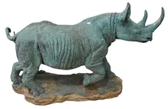 Untitled by Cast, bronze sculpture of rhinoceros on realistic ground base, offered May 2025