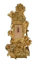 Maurice Maignan, Sunflower mantle clock, circa 1900, gilt, bronze, featuring Father Time over sundial clock face