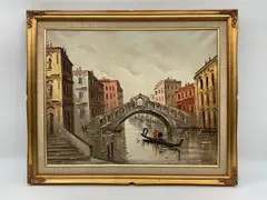 Antonio DeVity, A classic mid-century oil painting of a gondolier navigating a canal beneath the iconic Rialto Bridge in Venice, Oil on Canvas