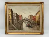 Antonio DeVity, A classic mid-century oil painting of a gondolier navigating a canal beneath the iconic Rialto Bridge in Venice, Oil on Canvas