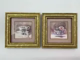 This charming pair of framed prints features delicate floral teacups illustrated by American artist Marilyn Simandle. Each piece presents a finely detailed watercolor style rendering of a porcelain teacup with blooming floral patterns by Marilyn Simandle, Lithograph, offered Jul 2026