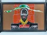 Striking by Cartier Panther Mask by Carlos Felix, mixed media collage featuring a masked face adorned with jeweled patterns, layer, offered Jul 2026