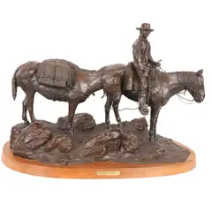Untitled by Keith Christie, bronze, "A New Land" on wood plinth, offered May 2024
