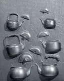 Arman, Senza titolo, 1998, assemblaggio di teiere tagliate on canvas con pittura acrilica argento