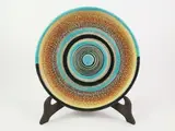Nikolaj Diulgheroff, A ceramic plate, decorato all'aerografo con fasce concentriche nei toni dell'ocra