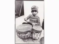Bambino con percussioni 1978 by Livia Sismondi, vintage gelatin-silver print on baryta paper, offered Mar 2020